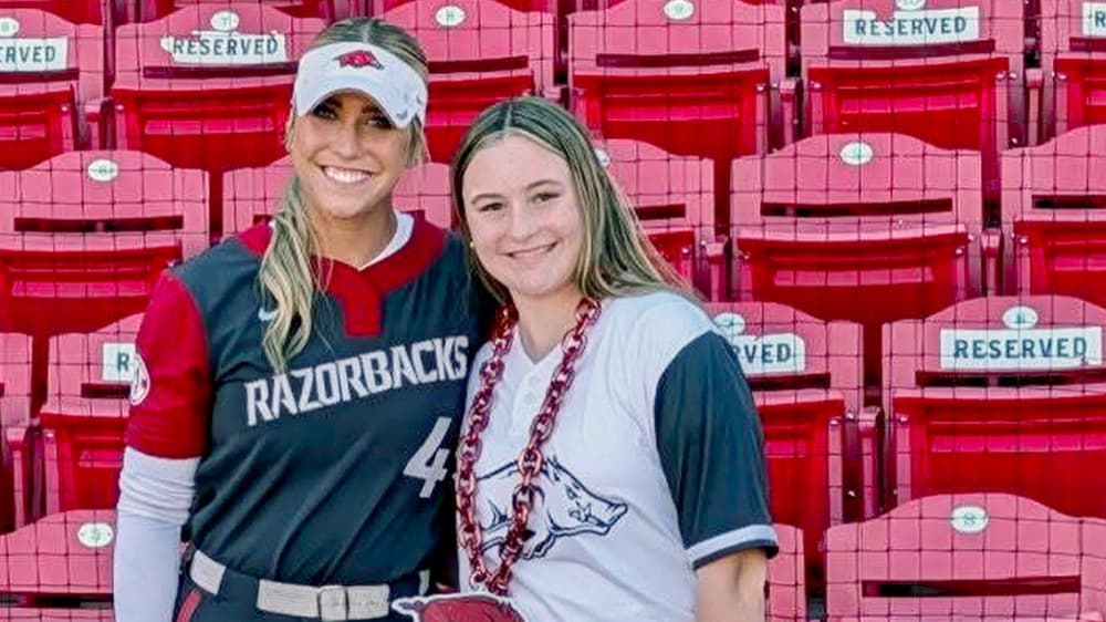 Scarlet with her mentor Reis, an Arkansas Razorbacks softball player